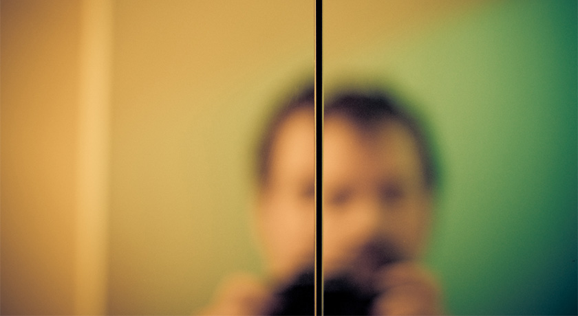 Man looking in mirror