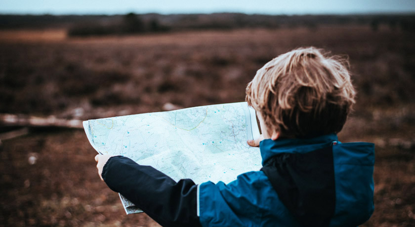 Boy checking a map