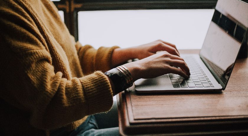 Woman typing on laptop