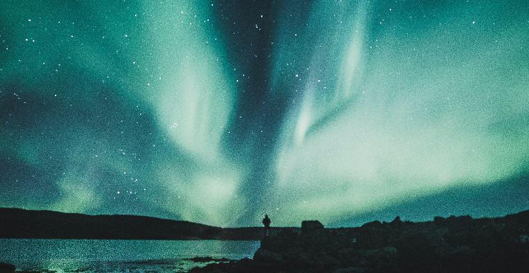 A man watching the Aurora Borealis